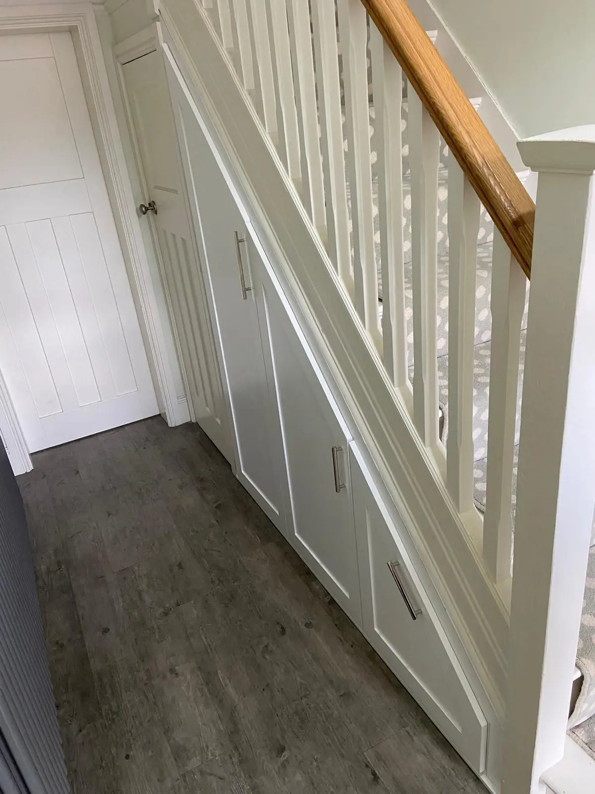 white-under-stairs-storage